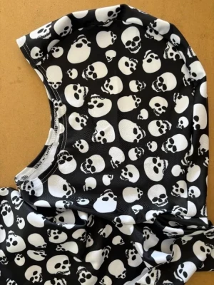 New! Lycra Fully Trimmable Hood "Skulls Design" - Product Image